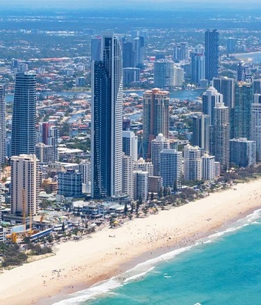 Aerial view coastal city with skyscrapers sandy beach