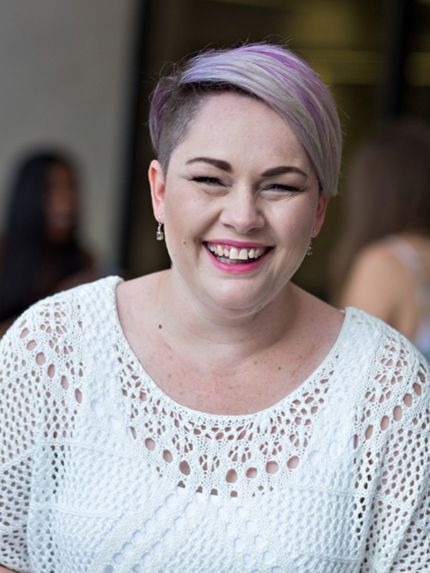 Student outside campus happy laughing