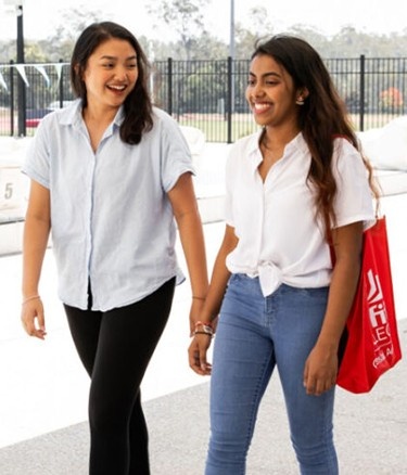 Female students walking sport pool facilities