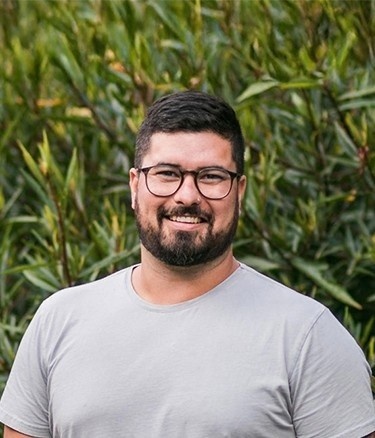 Mature age student outside happy