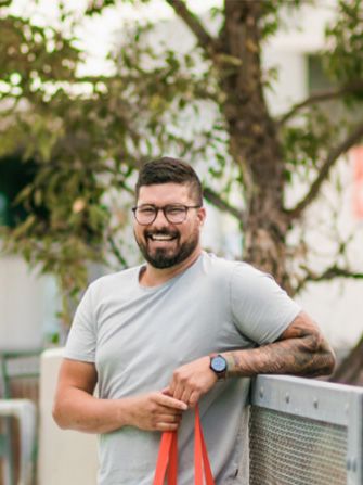 Mature age student outside happy