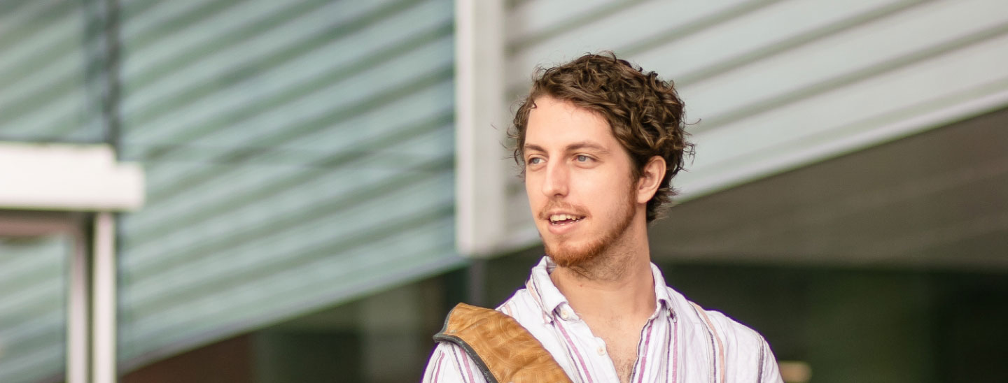 Student happy standing outside