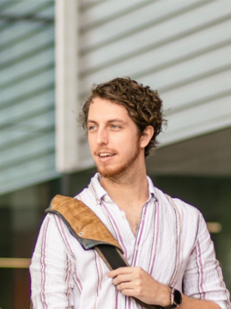 Student happy standing outside