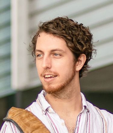 Student happy standing outside