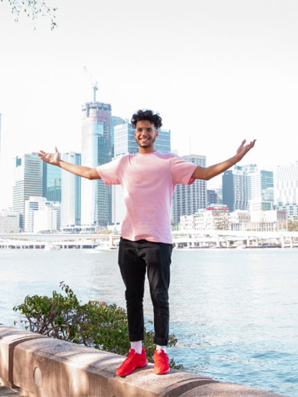 Student outside Brisbane happy standing