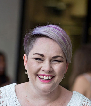 Student outside campus happy laughing