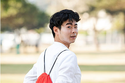 Student red backpack outside