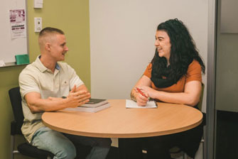 Student teacher on campus together meeting