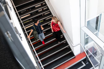 Student teacher walking down stairs