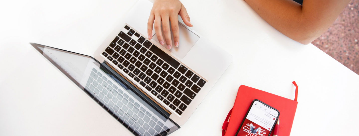 Student typing laptop