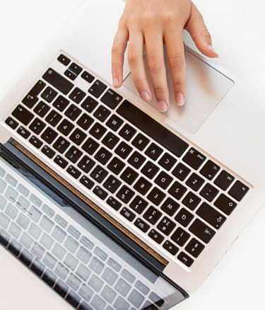 Student typing laptop
