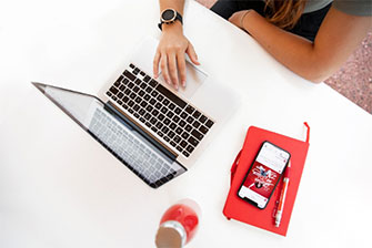Student typing on campus