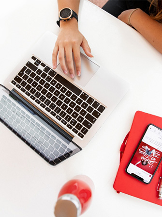 Student typing on campus