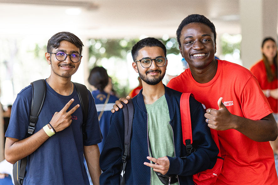 Students making winning symbol