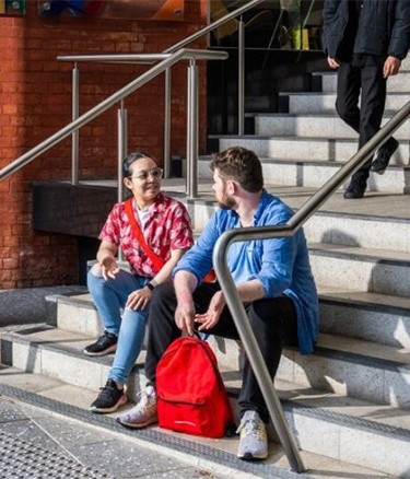Students sitting stairs