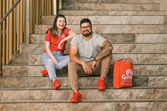 Students sitting stairs happy together