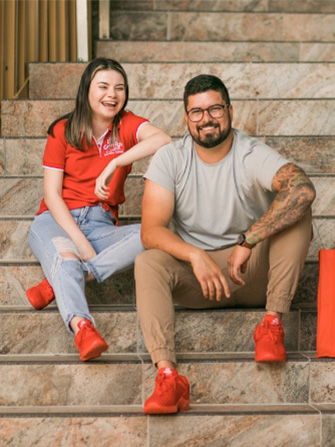 Students sitting stairs happy together