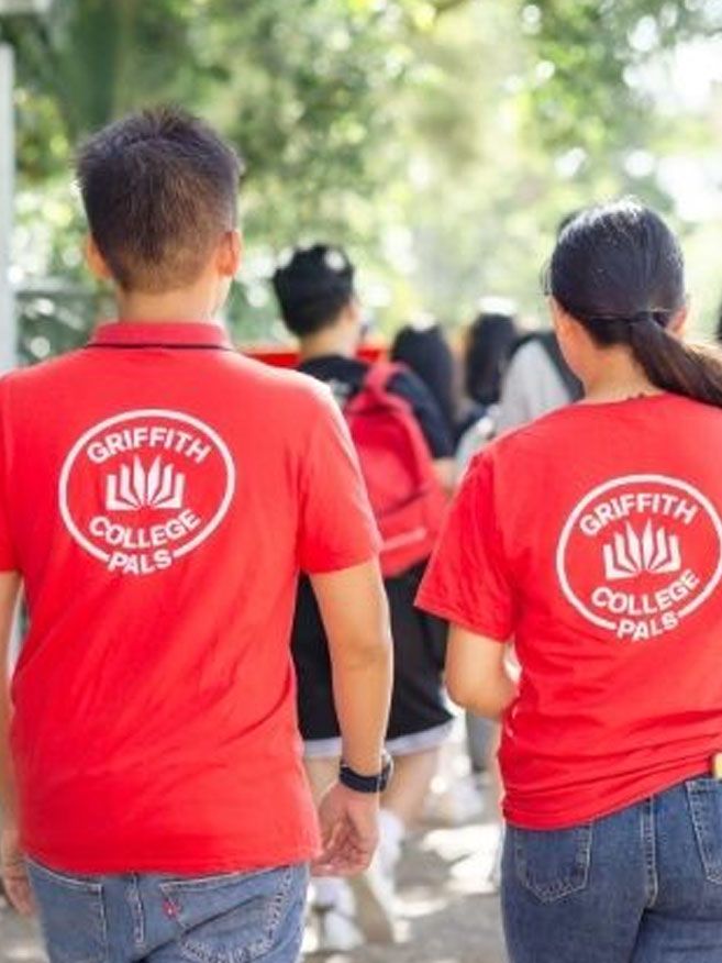 Students walking outside in the college
