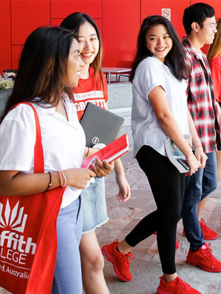 Students walking outside campus red shoes