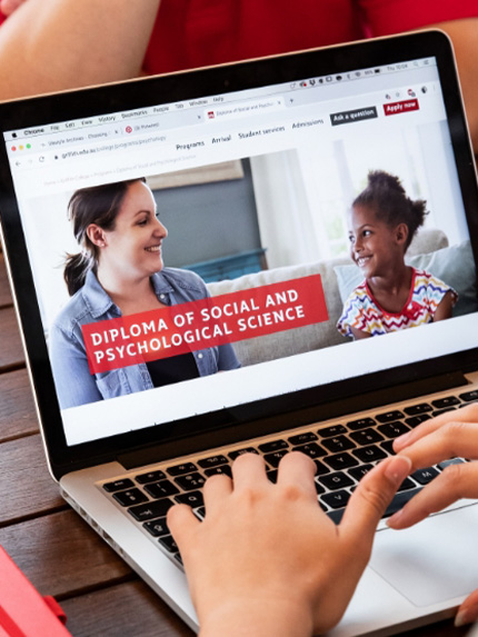 Students working outside on laptop