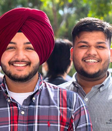 International students standing in garden